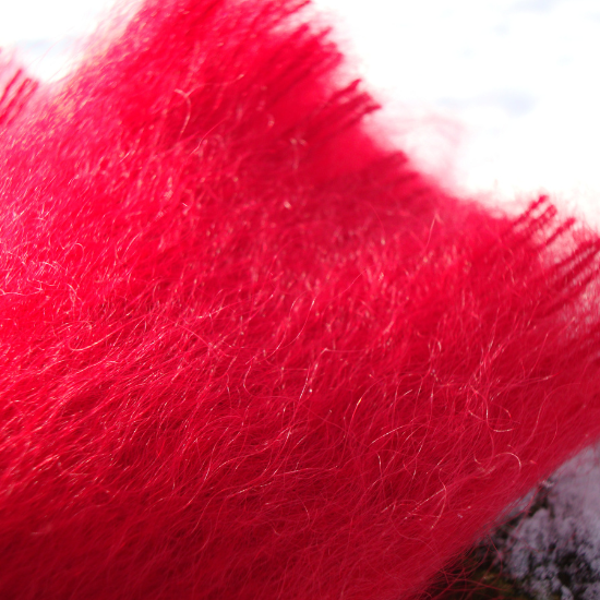Close-up of a luxuriously soft plain red mohair blanket with a gently brushed finish and subtle fringe—part of the Plain Blanket Collection.