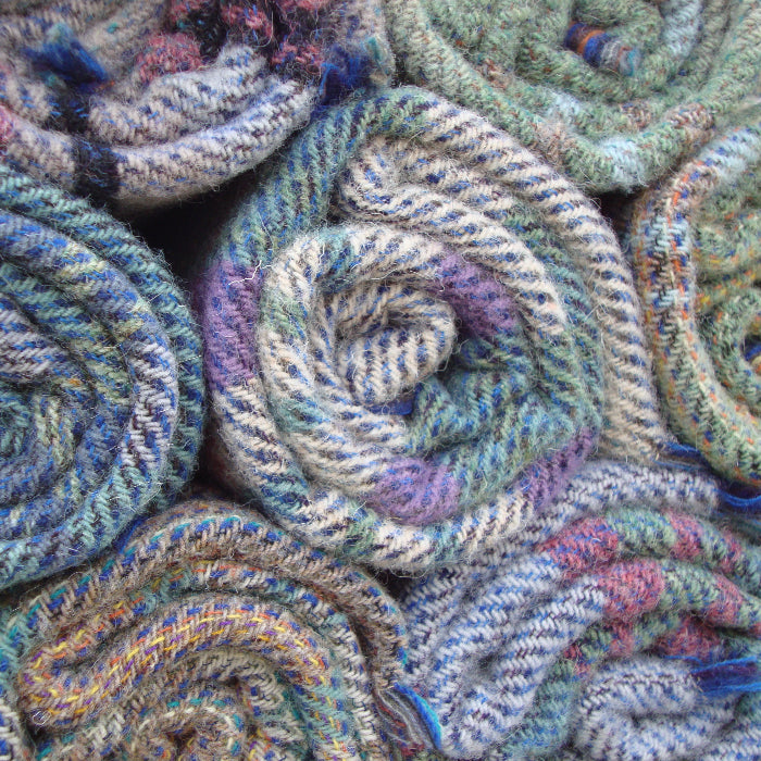 Close up of colourful recycled rolls of wool blankets