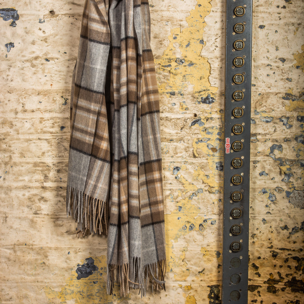 McKellar tartan blanket hanging on a wall hook