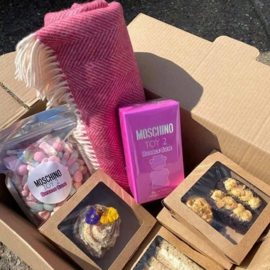 Moschino Toy 2 perfume brand launch hamper with brand coloured solway blanket, food items and branded merchandise