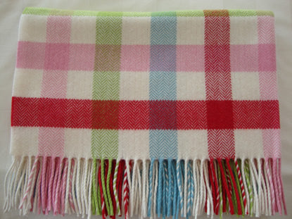The woven Baby Bunting Cashmere Mix baby blanket with a bold check pattern in pink, red, light blue, and green on a white base, folded neatly showing finished with fringed edges.