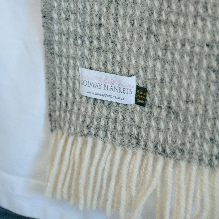 Cloud grey textured throw blanket with a Solway Blankets label against a white background