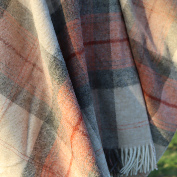 Coral Skye Check Shetland Wool Throw Plaid fabric with a mix of rust, terracotta warm beige and hint of charcoal grey colours.