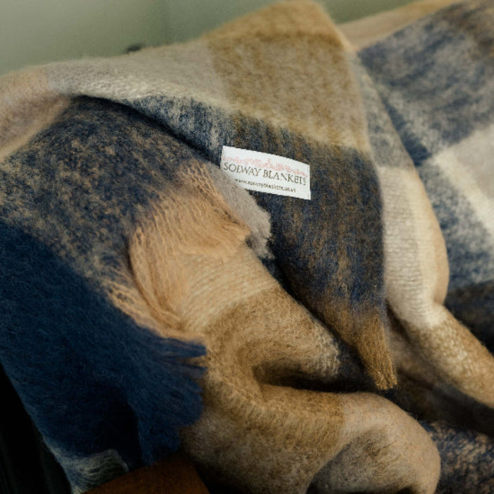 Denim & Stone Mohair Throw Plaid blanket with a visible Solway Blankets brand label on a neutral background, Navy blue, beige, tan and cream checks