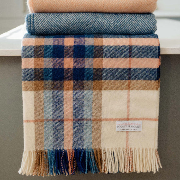 Falmouth Blue & Ivory Check Shetland Wool Blanket with other co-ordinating blankets against a neutral background