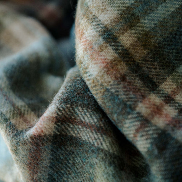 Close-up of Glen Coe Shetland Pure New Wool Blanket with a blurred background