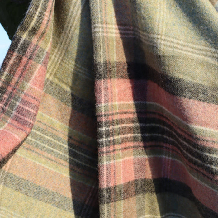 Close-up of plaid Green Kintyre Check Shetland Wool Throw with a green and pink pattern