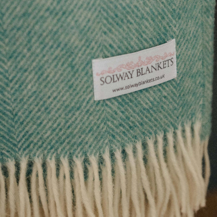 Teal, Jade Green Herringbone Shetland Wool Throw with Solway Blankets label.
