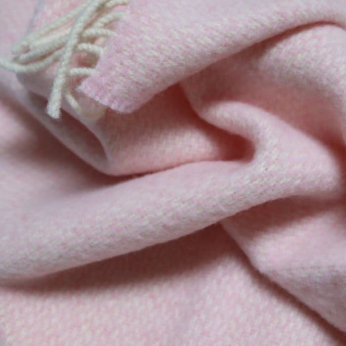 Close-up of Niamh Baby Pink Cashmere Baby Blanket with fringe and super soft feel