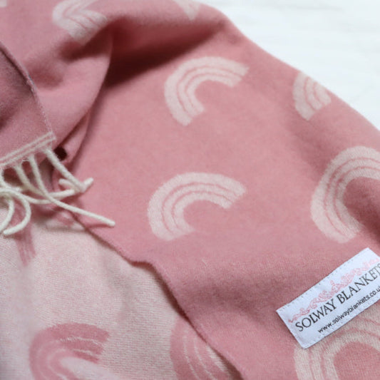 Rainbow Pink Merino Wool Baby Blanket with white and fringes, featuring a 'Solway Blanket' label.