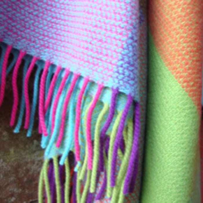 Colorful cashmere mix throw with fringe details