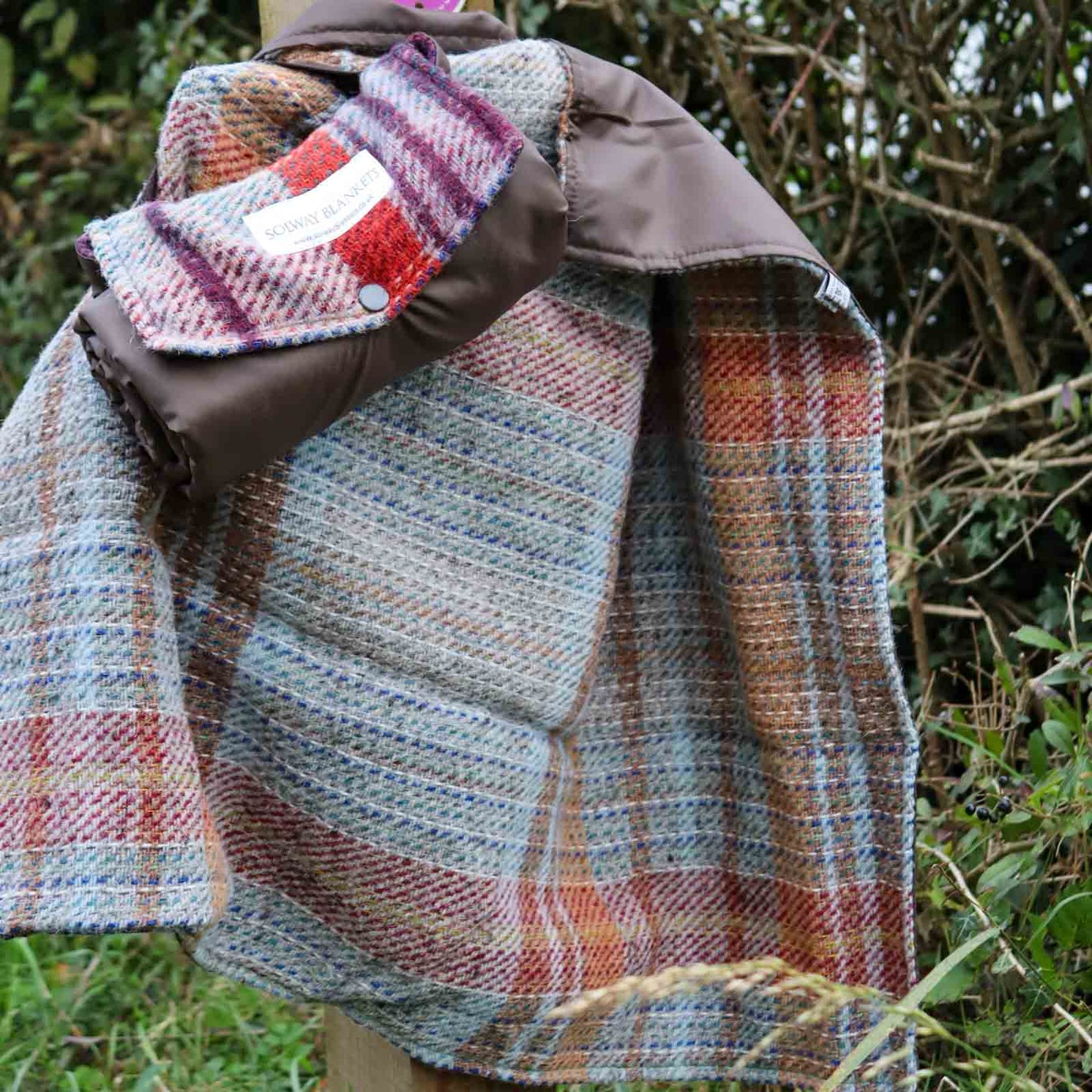 Random Recycled Waterproof Walker’s mini picnic rug rolled up by pathway sign