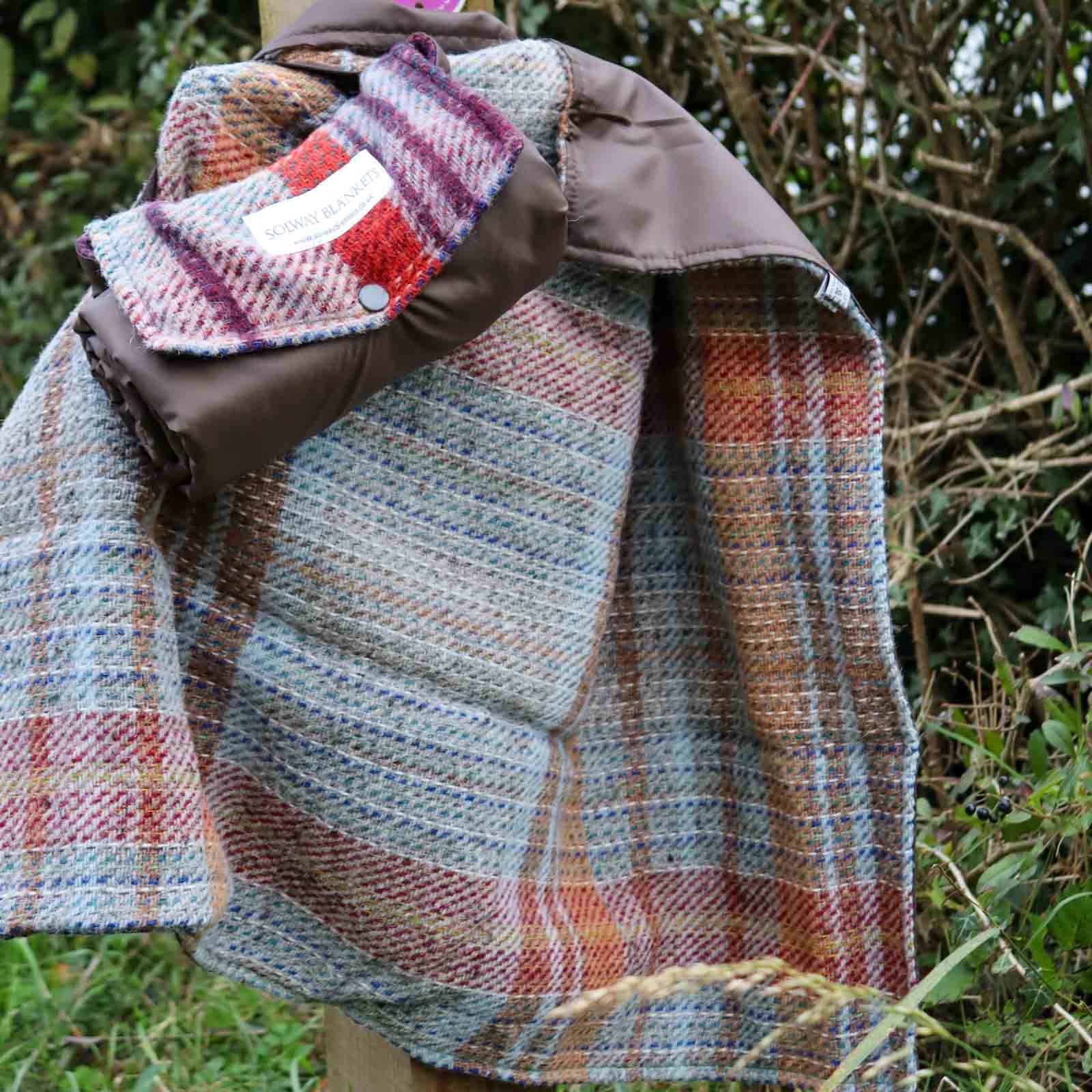 Random Recycled Waterproof Walker’s mini picnic rug rolled up by pathway sign