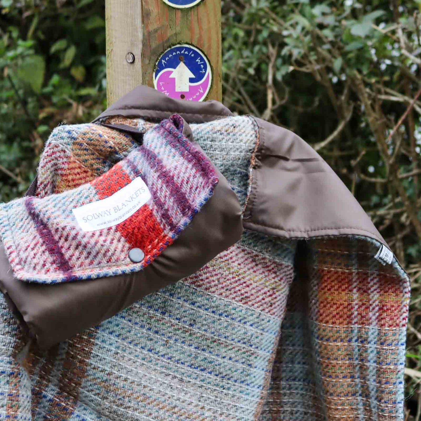 Random Recycled Waterproof Walker’s small outdoor picnic blanket spread over trail walk, hiking way-marker post