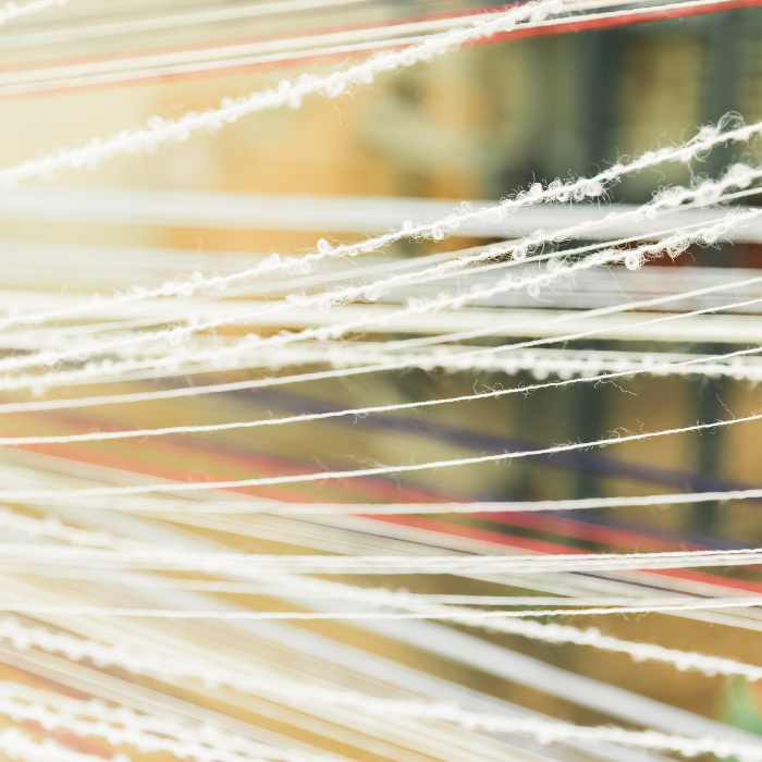 Close-up of wool threads that have been spun into yarn with a blurred background